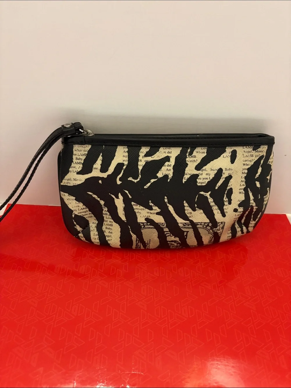 L.A.M.B. Black and Cream Zebra-Print Clutch with Logo Plate